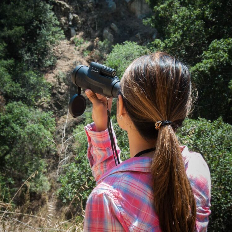 woman with monocular